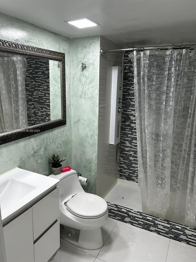 full bath featuring tile patterned floors, toilet, a stall shower, and vanity