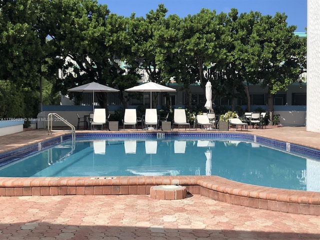 community pool with a patio