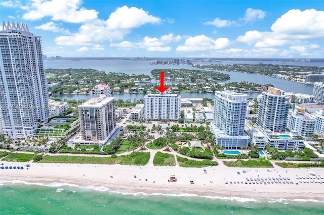 bird's eye view featuring a beach view and a water view