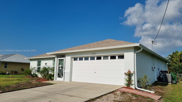 ranch-style house with stucco siding, a garage, cooling unit, and concrete driveway