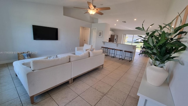 living area featuring light tile patterned floors, recessed lighting, baseboards, and ceiling fan