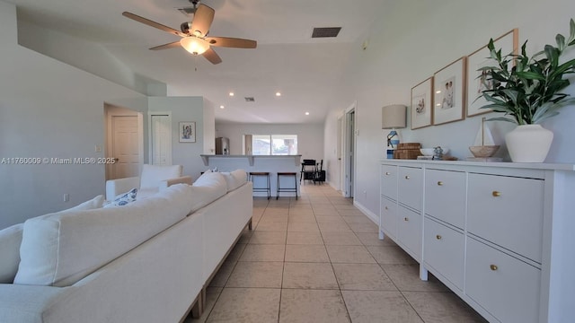 living room with recessed lighting, light tile patterned floors, a ceiling fan, and visible vents