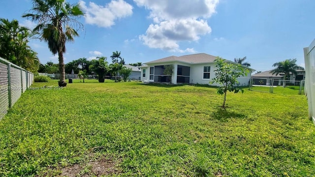 view of yard with a fenced backyard