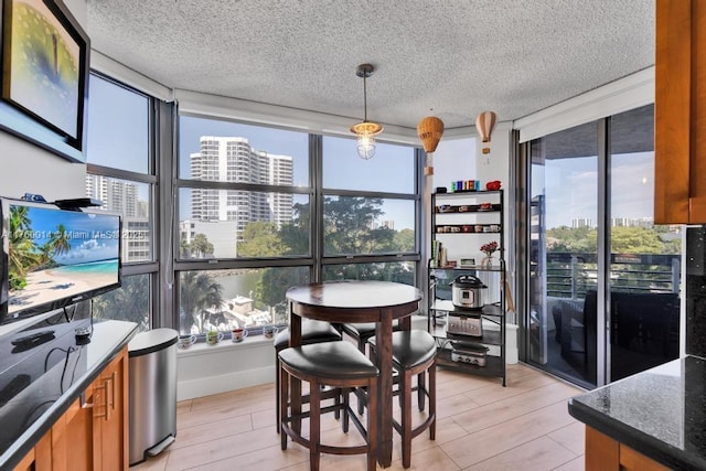 sunroom / solarium featuring a view of city