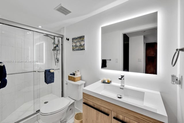 full bath with vanity, toilet, visible vents, and a stall shower