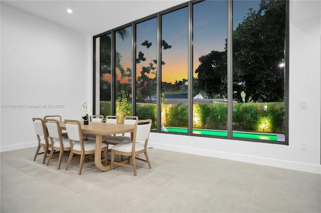 dining area with recessed lighting and baseboards