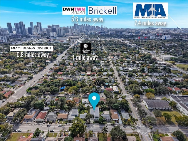 birds eye view of property with a view of city