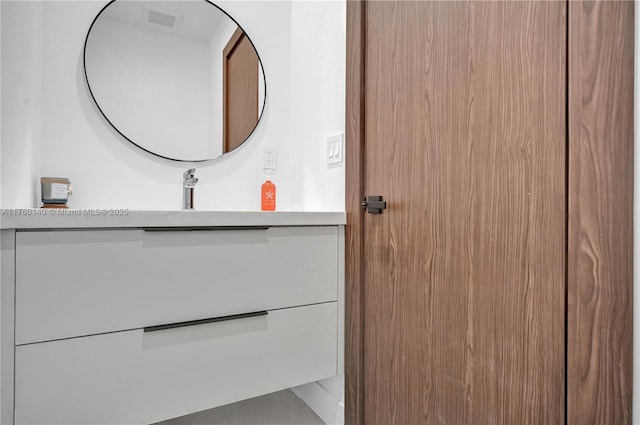 bathroom featuring visible vents and vanity