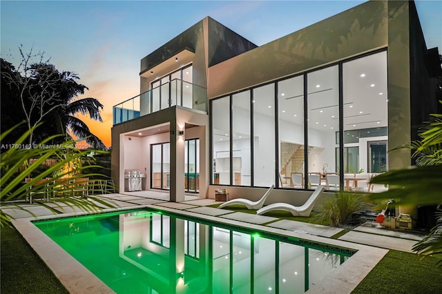 pool with a patio