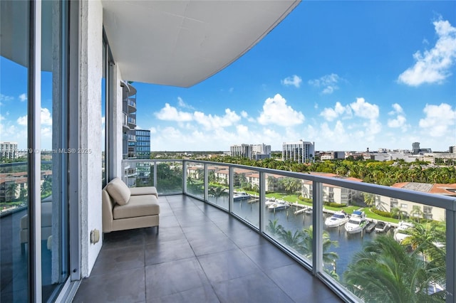 balcony featuring a view of city and a water view