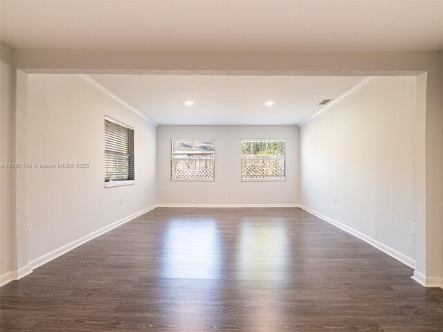 1735 18th St, Vero Beach, FL 32960 - unfurnished room with crown molding, healthy amount of natural light, dark wood-style floors, baseboards, and recessed lighting
