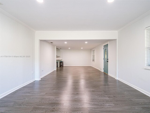 1735 18th St, Vero Beach, FL 32960 - unfurnished living room with dark wood-style flooring, recessed lighting, baseboards, and ornamental molding
