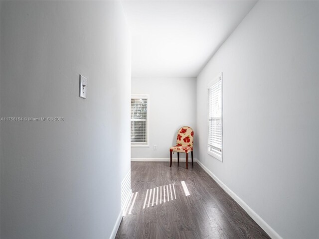1735 18th St, Vero Beach, FL 32960 - corridor with dark wood-type flooring and baseboards