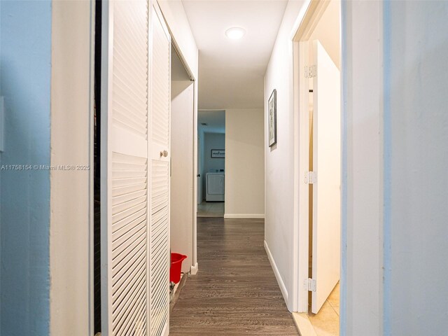 1735 18th St, Vero Beach, FL 32960 - corridor with washer / dryer, wood finished floors, and baseboards