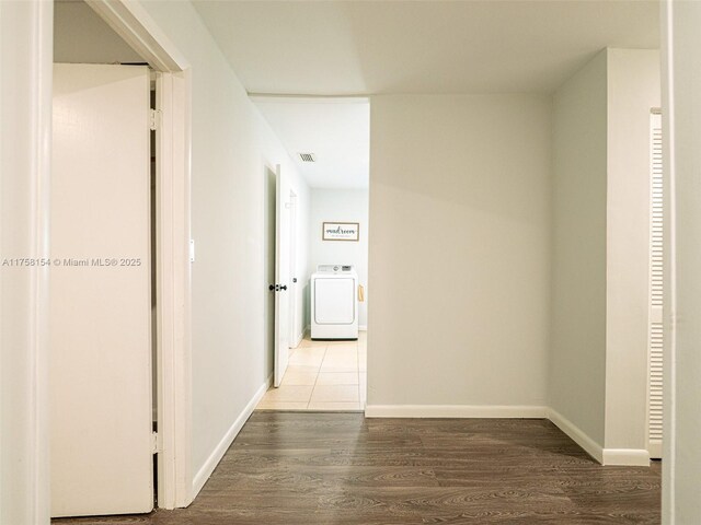 1735 18th St, Vero Beach, FL 32960 - hall featuring washer / clothes dryer, wood finished floors, and baseboards