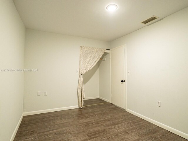 1735 18th St, Vero Beach, FL 32960 - unfurnished room with dark wood-type flooring and baseboards