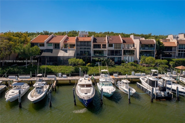 view of dock featuring a residential view and a water view