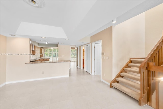 interior space featuring light tile patterned floors, stairway, recessed lighting, and baseboards