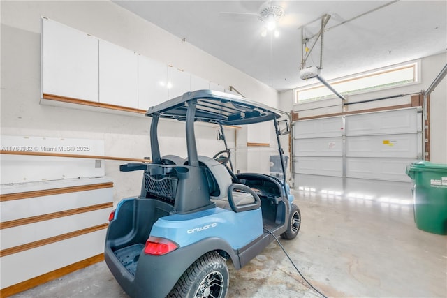 garage featuring a garage door opener and baseboards