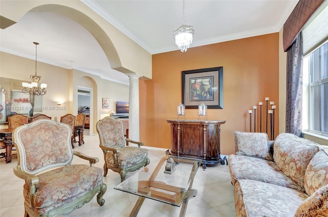 tiled living room with an inviting chandelier, decorative columns, crown molding, and baseboards