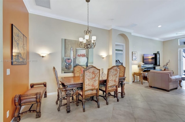 dining space with arched walkways, a notable chandelier, baseboards, and ornamental molding