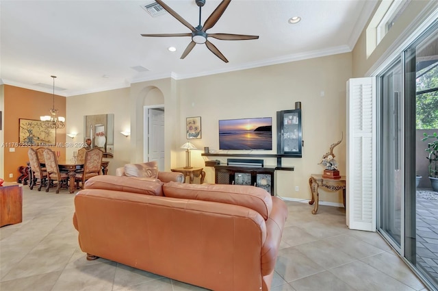 living room featuring visible vents, baseboards, arched walkways, and crown molding