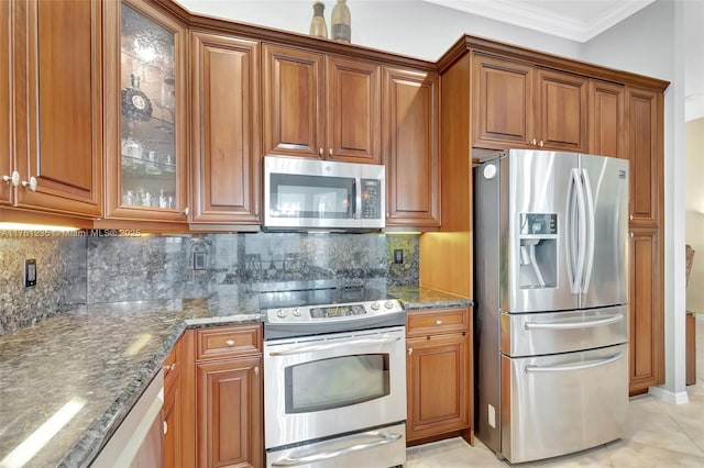 kitchen with crown molding, brown cabinets, and appliances with stainless steel finishes