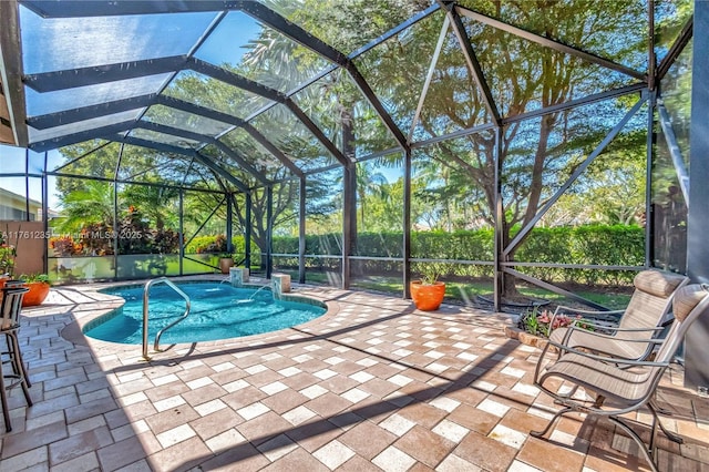 view of pool featuring a patio area, a fenced in pool, and a lanai