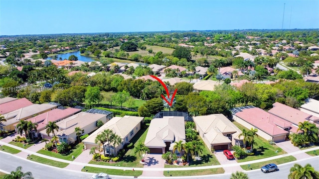 birds eye view of property featuring a residential view and a water view