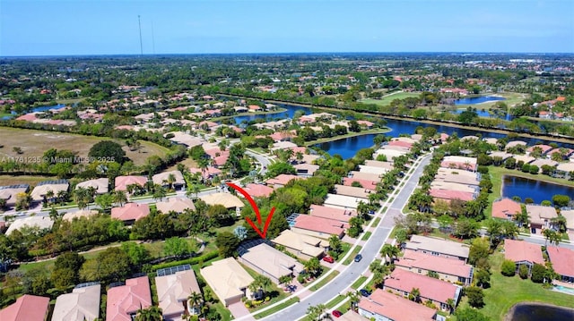 bird's eye view with a residential view and a water view