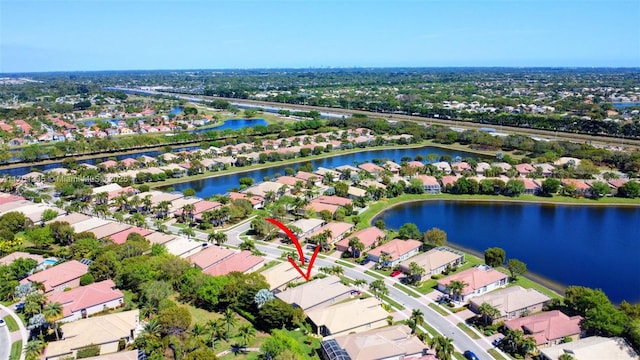 aerial view featuring a residential view and a water view