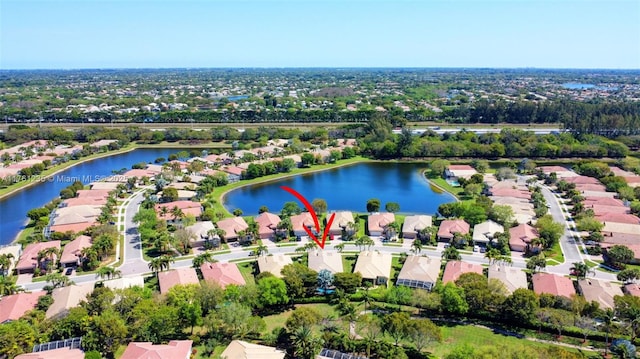 birds eye view of property with a residential view and a water view