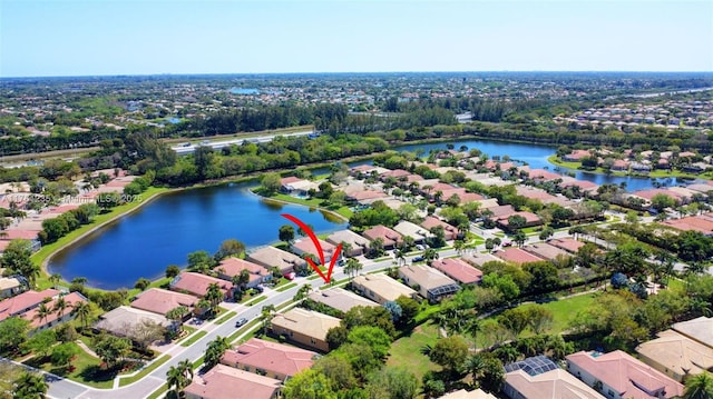 aerial view with a water view and a residential view