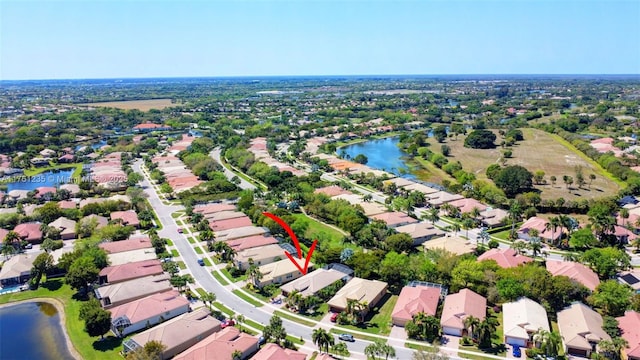 aerial view with a water view and a residential view