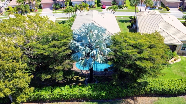 birds eye view of property with a residential view