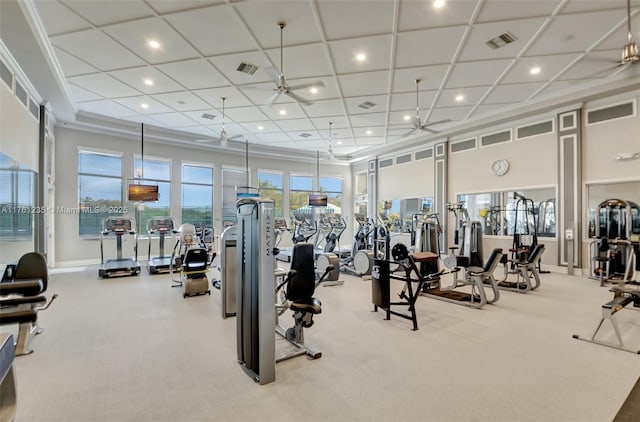 workout area featuring a high ceiling, carpet flooring, baseboards, and visible vents