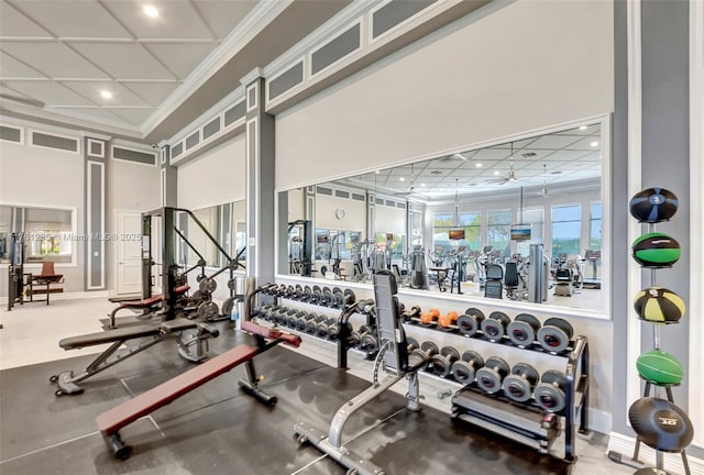 gym featuring recessed lighting, baseboards, and ornamental molding