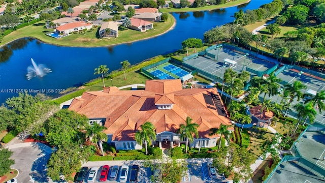 drone / aerial view with a residential view and a water view