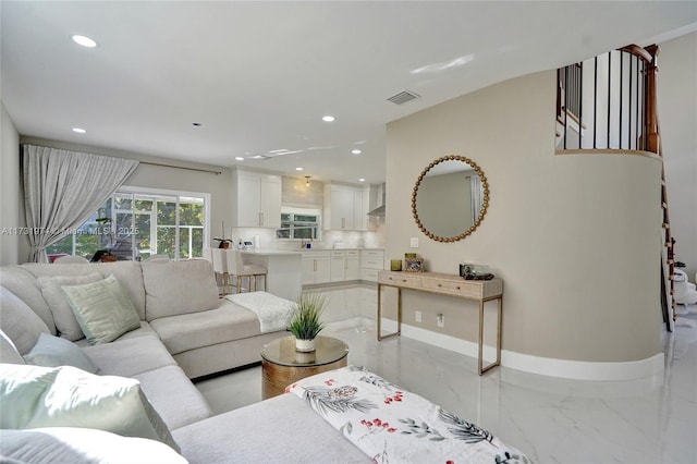 living area with visible vents, recessed lighting, baseboards, and marble finish floor