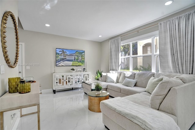 living area featuring recessed lighting, marble finish floor, and baseboards