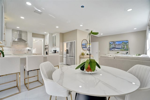 dining space featuring visible vents and recessed lighting