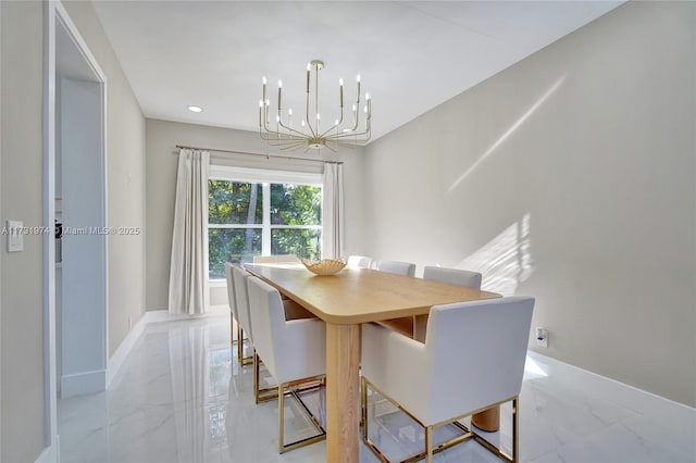 dining room featuring recessed lighting, baseboards, marble finish floor, and an inviting chandelier