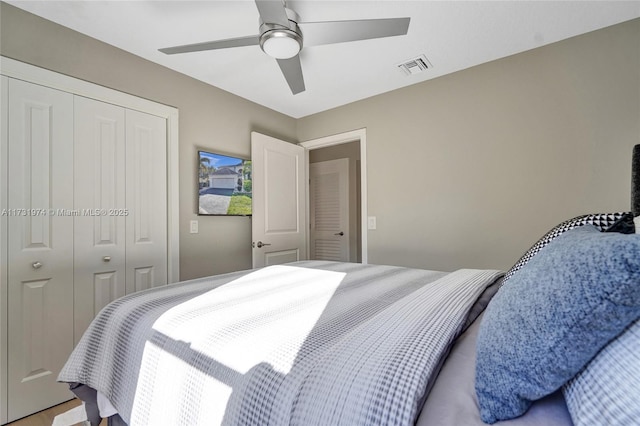 bedroom with visible vents, a closet, and ceiling fan