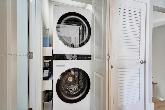 laundry area featuring laundry area and stacked washer and dryer