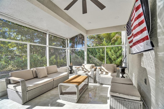 sunroom / solarium featuring ceiling fan