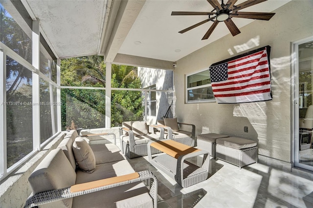 sunroom featuring ceiling fan