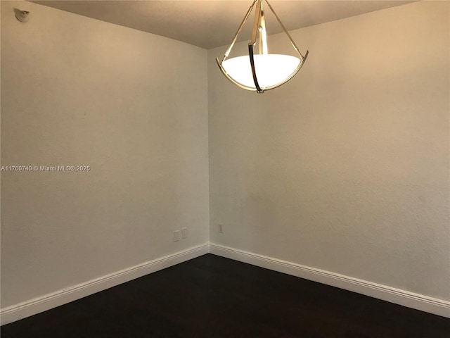 empty room with baseboards