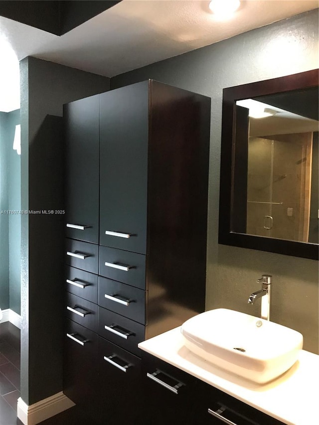 bathroom featuring vanity and baseboards