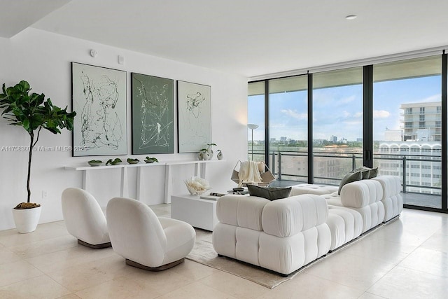 living room featuring a city view and a wall of windows