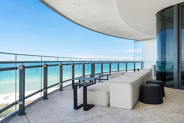 balcony featuring a water view